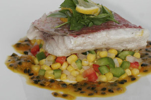 grilled fish served on corn salsa with passion fruit sauce