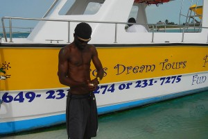 cleaning conch on a snorkel tour