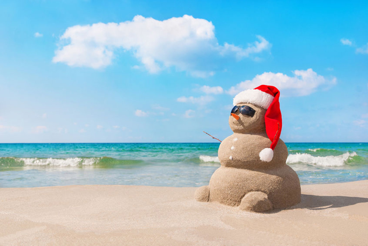 Snowman Made Out Of Sand On The Beach